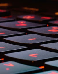 Keyboard with red lights illuminating the key letters